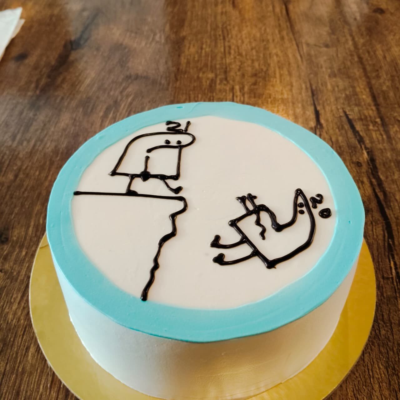 Custom decorated cake with a hand-piped illustration