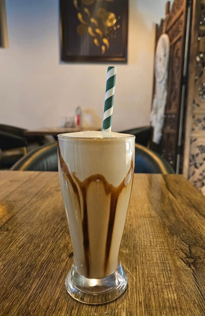 Iced cold coffee served in a tall glass