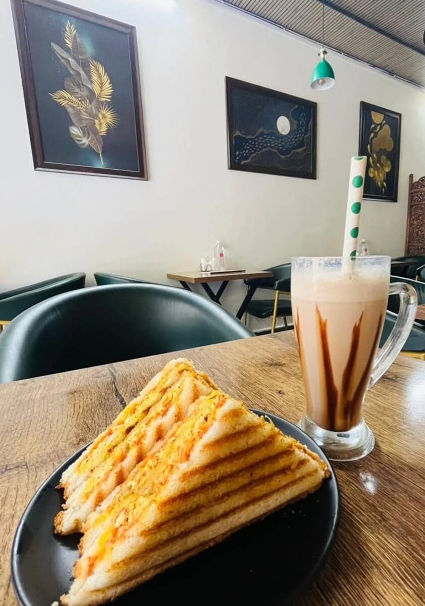 Grilled sandwich served with a hot beverage